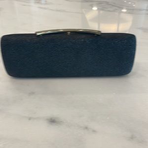 Vince Camuto black clutch with optional gold crossbody chain.